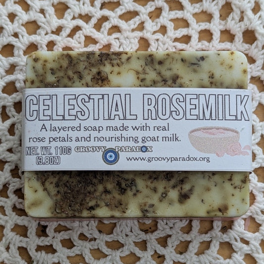 Bar of soap labeled 'Celestial Rosemilk' on a qhite textured surface